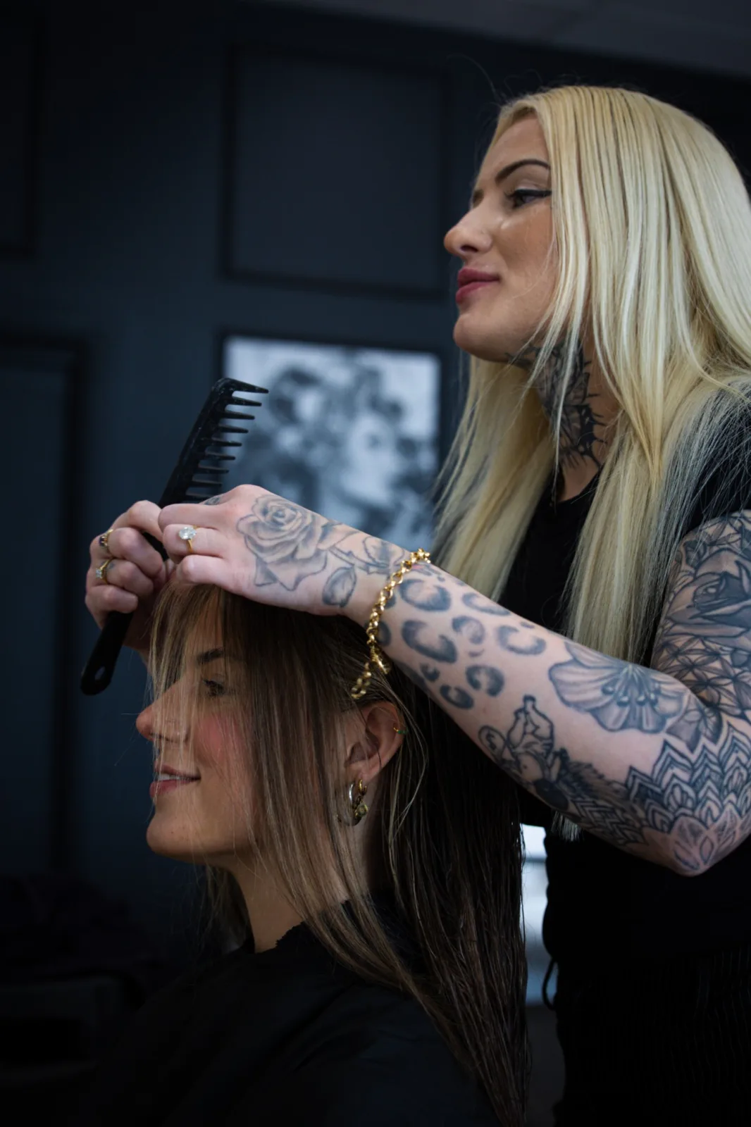 Hairstylist preparing a client during a salon shoot
